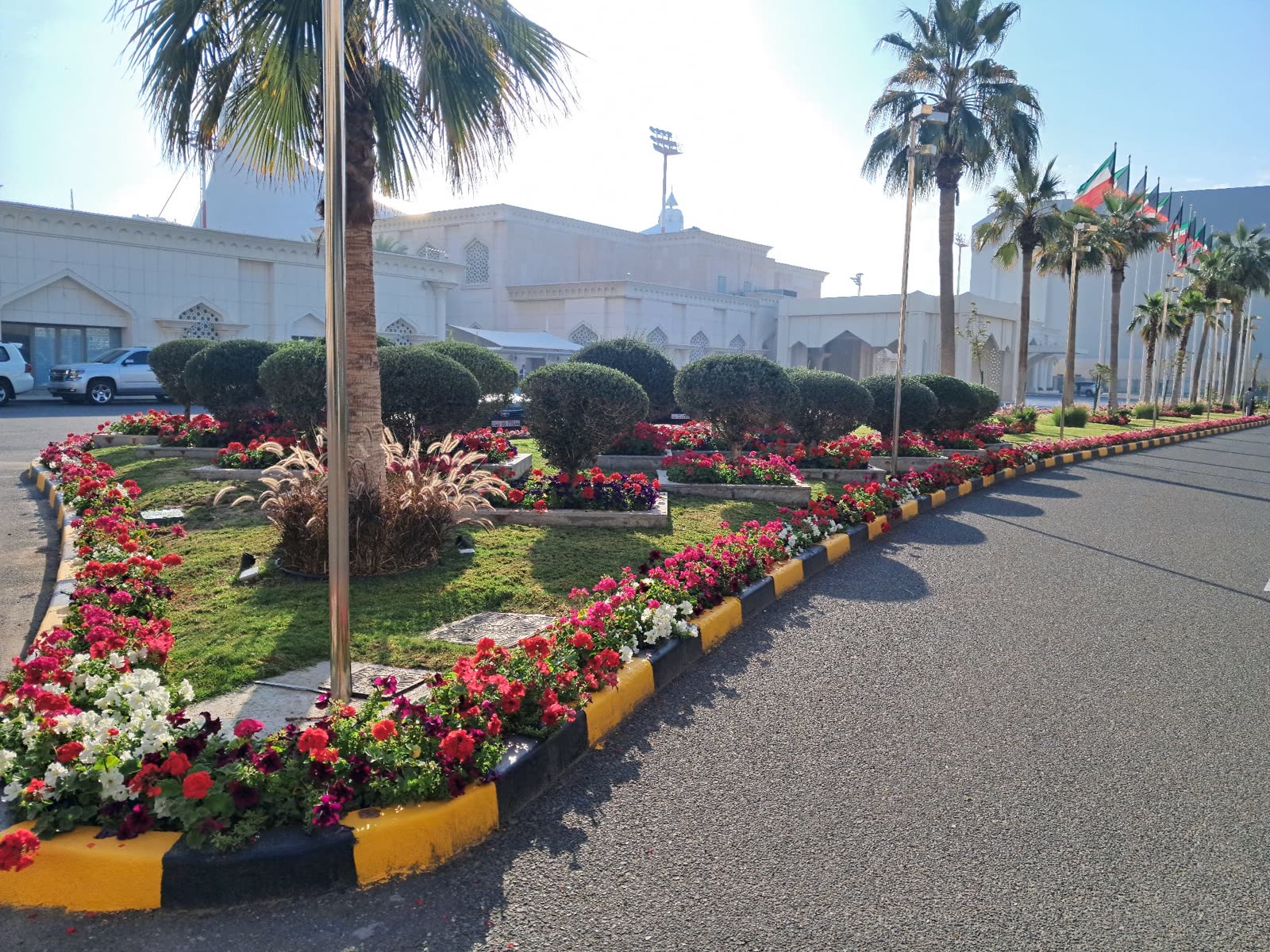 Flower-lined entrance beds at the palace