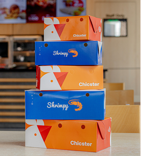 Stacked Shrimpy and Chicster delivery boxes